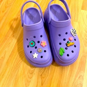 Brand new Crocs sandals, complete with accompanying charms, have never been worn